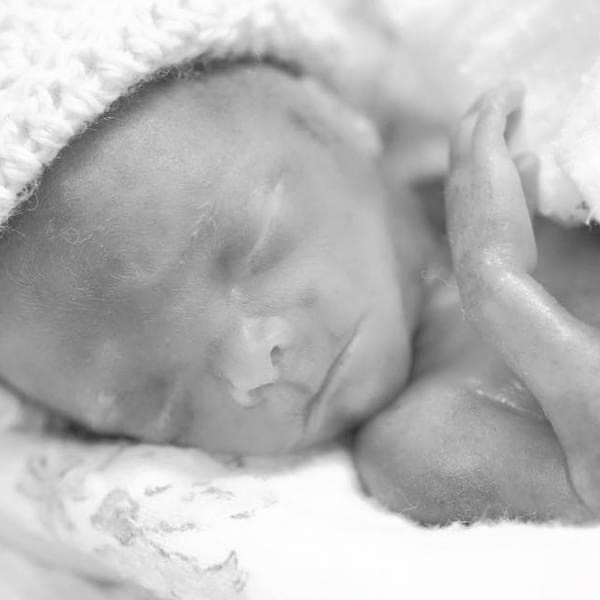 Aidan sleeping peacefully as a newborn